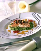 grilled salmon on minted pea purree with red pepper juice